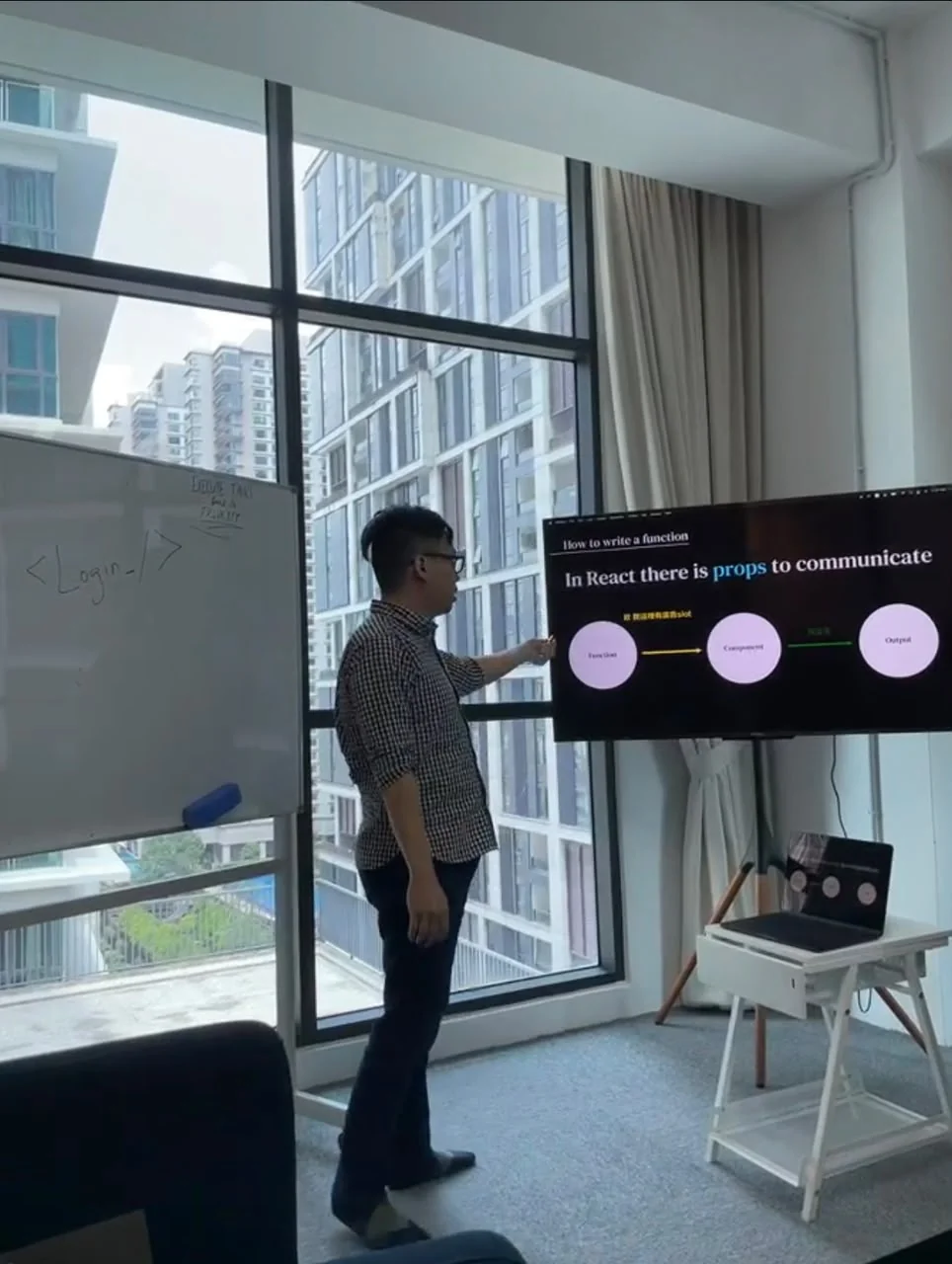 Team member presenting a programming topic at the office in 2023